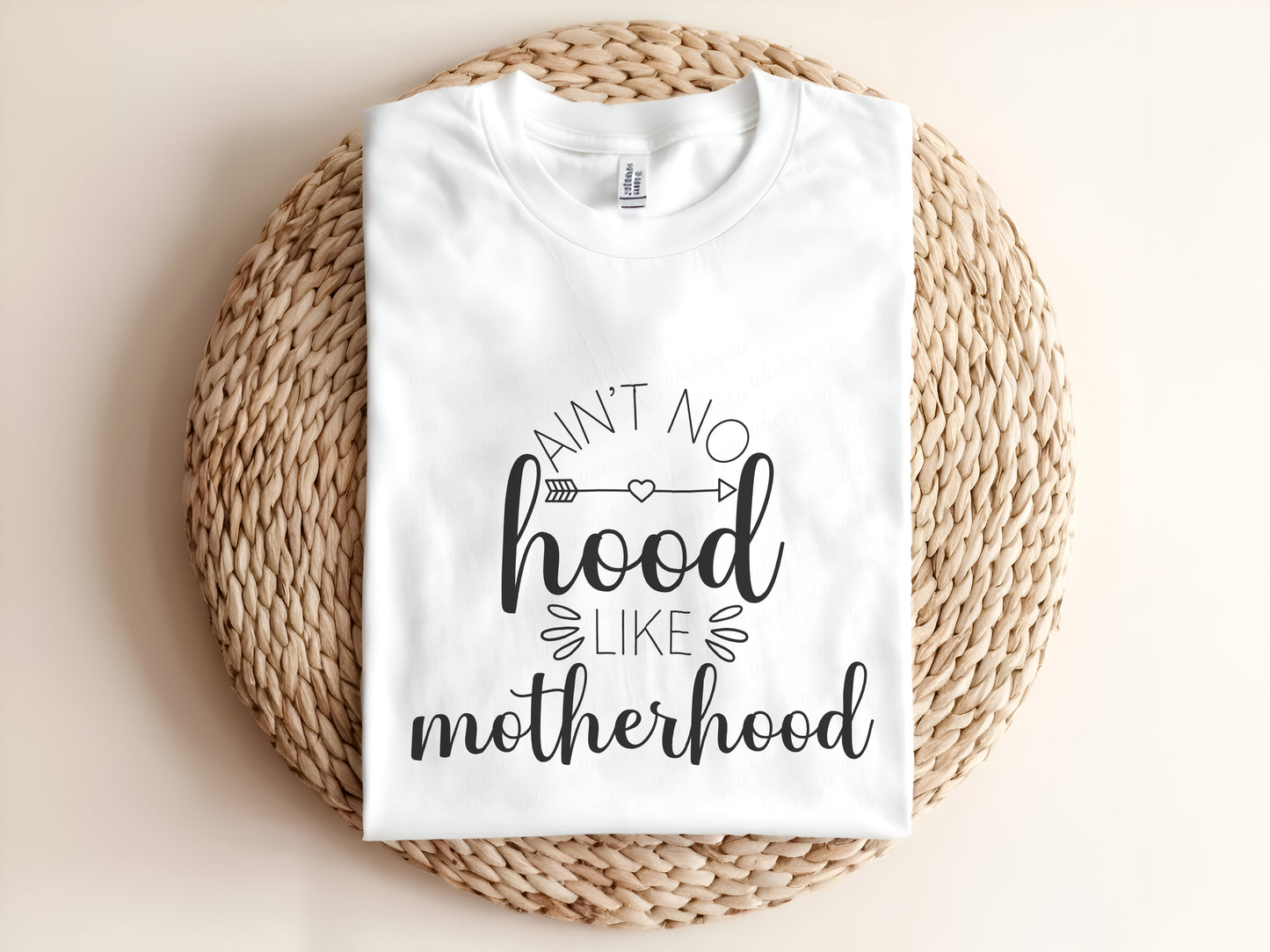Adult graphic t-shirt featuring “Ain’t No Hood Like Motherhood” slogan, funny unisex tee perfect for moms and casual everyday wear.