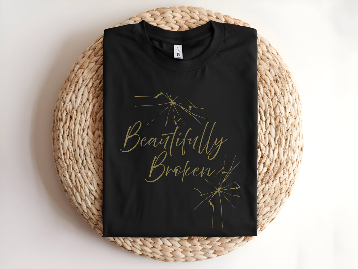 Adult graphic t-shirt featuring “Beautifully Broken” slogan, unisex tee with inspirational message for everyday wear.
