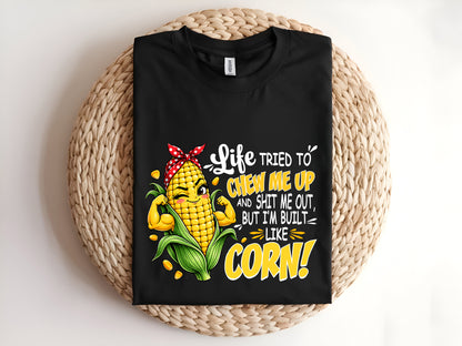 Life TRIED TO CHEW ME UP AND SHIT ME OUT, BUT I'M BUILT LIKE CORN Adult T-Shirt