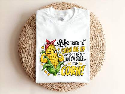 Life TRIED TO CHEW ME UP AND SHIT ME OUT, BUT I'M BUILT LIKE CORN Adult T-Shirt