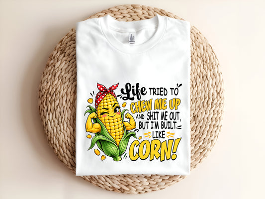 Life TRIED TO CHEW ME UP AND SHIT ME OUT, BUT I'M BUILT LIKE CORN Adult T-Shirt