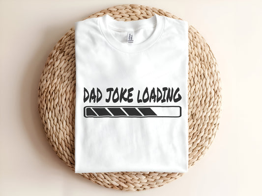 Adult graphic t-shirt featuring “Dad Joke Loading” slogan, funny unisex tee for dads.