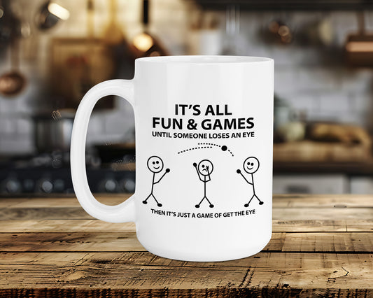 IT'S ALL FUN & GAMES UNTIL SOMEONE LOSES AN EYE Classic Ceramic Mug