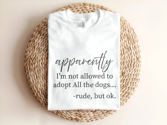 Adult graphic t-shirt featuring “Apparently I’m Not Allowed to Adopt All the Dogs” slogan, funny unisex tee for dog lovers.