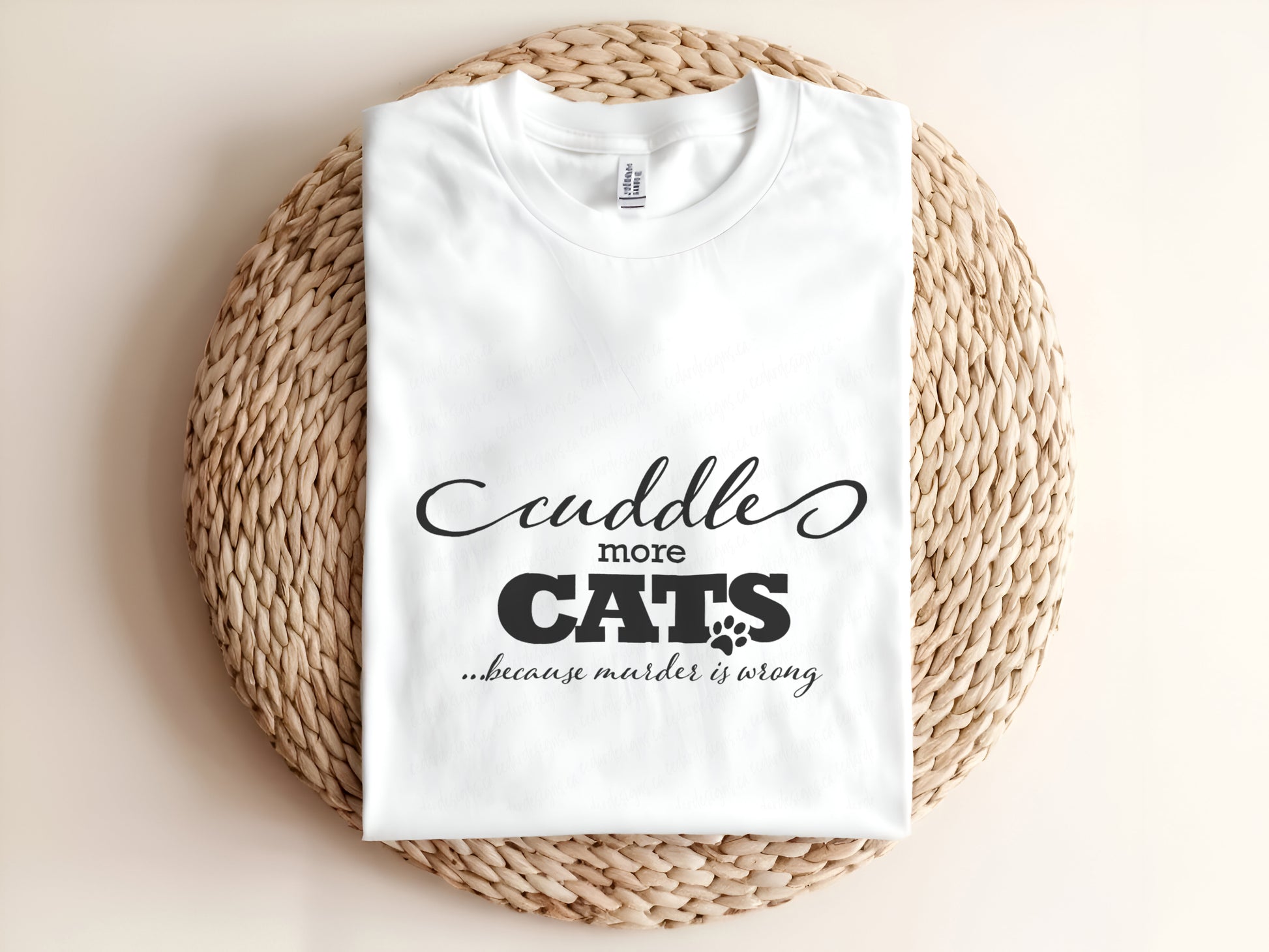 Adult graphic t-shirt featuring “Cuddle More Cats Because Murder Is Wrong” slogan, humorous unisex tee for cat lovers.